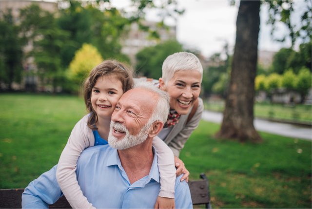 Multiple generations of a family spending time together outdoors